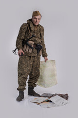 A male actor in the historical uniform of an officer of an army reconnaissance group of the Soviet...