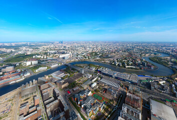 Fototapeta premium Scenic panoramic aerial view of the park and the construction of a new district in Moscow, Russia. the territory of the destroyed car plant in the south of Moscow. Landscape from a drone.
