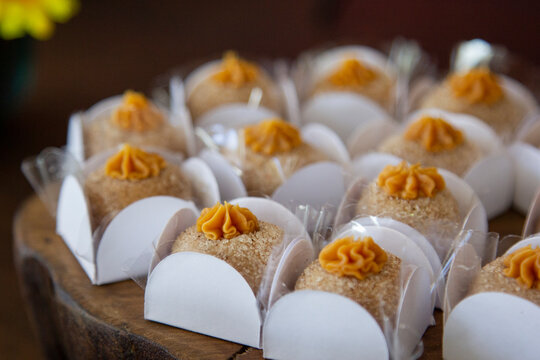 Dulce de leche brigadeiro on the decorated birthday table, traditional Brazilian party candy.