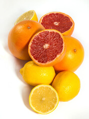 Lemons and grapefruits on a white background.