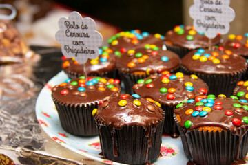 Cupcake varieties with decorative plate with the phrase 