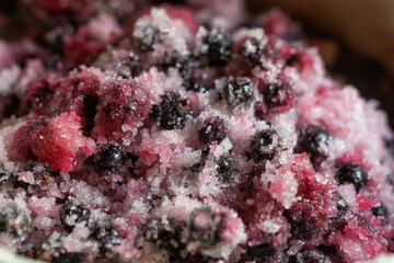 Fototapeta na wymiar Cooking black currant jam. Berries are covered with sugar in a pan
