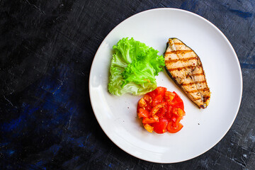 fried salmon grilled portion serving vegetables salad tomato food background top view copy space for text organic eating healthy keto or paleo diet pescetarian