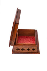 Wooden open carved box handmade with red velvet inside. Indian culture. Isolated on a white...
