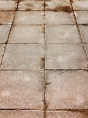 Urban road is paved with blocks of stone, cobblestone walkway