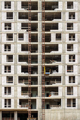 Fototapeta na wymiar Construction of a monolithic multi-storey building made of concrete