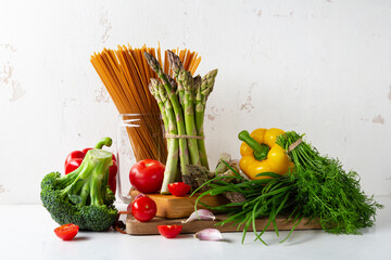 Ingredients for cooking whole wheat brown pasta, spaghetti