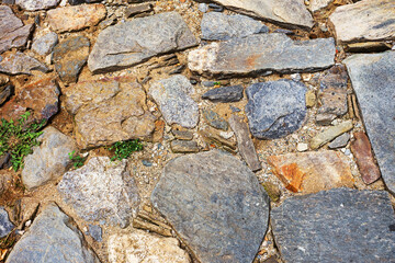 Urban stone paving. Texture, background, selective focus