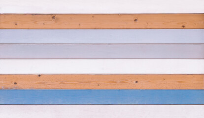 Wooden background made of varicoloured planks with natural texture.