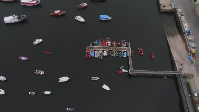 Boats moored in harbour of Spain. Aerial Drone Footage