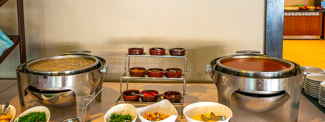 open buffet soup with herbs 
