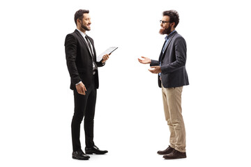 Two young men in formal clothes talking