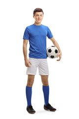 Full length portrait of a teenager soccer player with a ball under arm