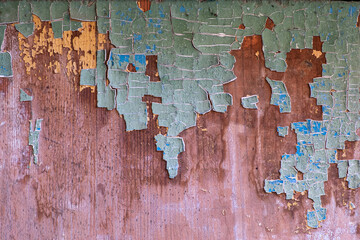 Old painted wood. Textured background of old wooden boards of different colors.