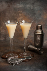  Liqueur or cocktail  in  glasses on the dark table