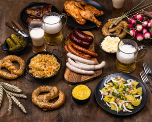 Oktoberfest dishes with beer, pretzel and sausage