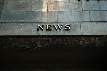 Generic sign of news agency written in english language