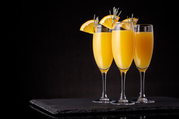Mimosa cocktails in champagne glasses