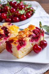 Fresh baked cake with red ripe juicy sour cherry or kriek berry