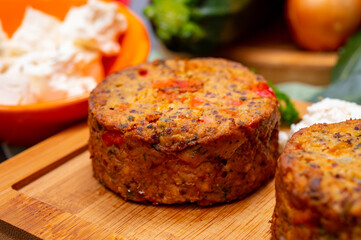 Tasty vegetarian food, burgers with Greek feta cheese, sweet red paprika, green olives and zucchini