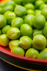 New harvest of ripe green peas legumes