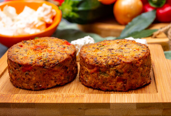 Tasty vegetarian food, burgers with Greek feta cheese, sweet red paprika, green olives and zucchini