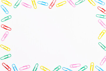 Colorful paper clips. Frame with paper clips with copy space for text.