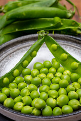 New harvest of ripe green peas legumes