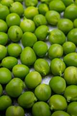New harvest of ripe green peas legumes