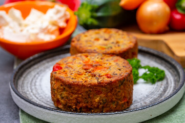 Tasty vegetarian food, burgers with Greek feta cheese, sweet red paprika, green olives and zucchini