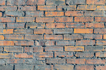 Old weathered brick wall as the background