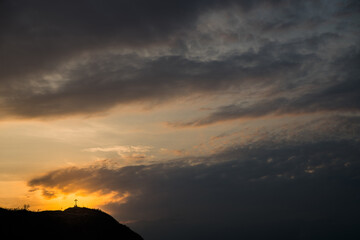 Christian cross. Silhouette against the sunset sky.