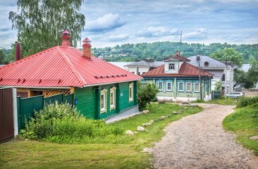 Fototapeta na wymiar Wooden houses in the city of Plyos, the Volga river and houses