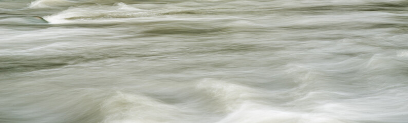 Obraz premium Blur the movement of water among the stones. Long exposure photography.