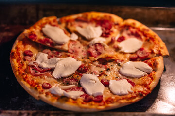 Appetizing pizza with delicious ingredients cooked in oven.