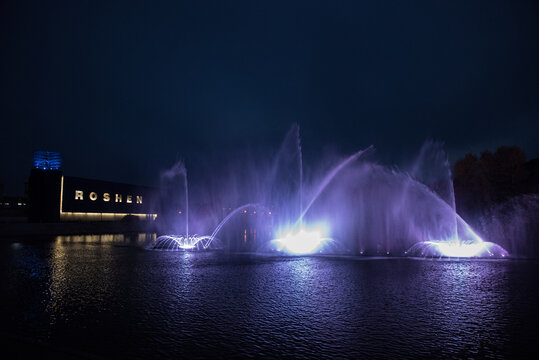 Musical multimedia fountain with colorful lights at night. Ukraine, Vinnitsa