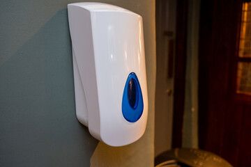 A hand sanitiser dispenser at an indoor venue as lockdown eases in the UK
