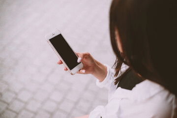 girl uses a smartphone for work