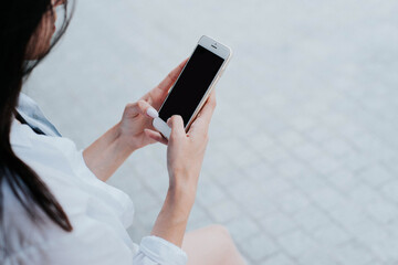 girl uses a smartphone for work