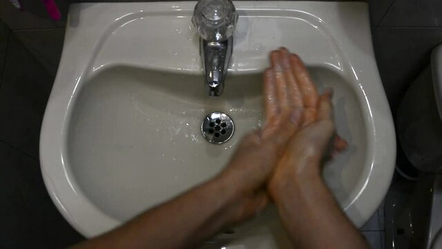 Hand Wash On A White Ceramic Sink With First Person Perspective POV.  White Caucasian Hands