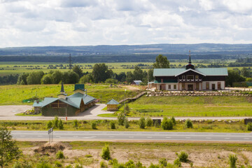 Obraz premium roadside hotel in the middle of a green field