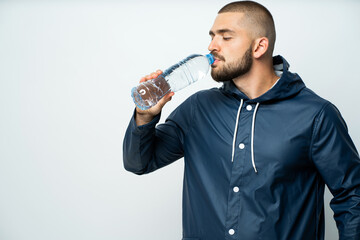 young man drinking water