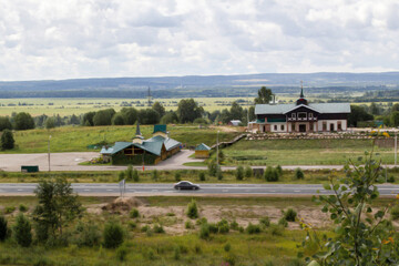 Small roadside hotel in a green field