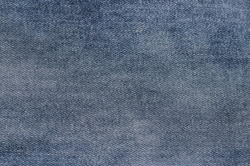 Fototapeta na wymiar Close-up of blue denim texture. Denim jeans background