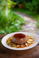 Gastronomy. Chocolate mousse with kiwi fruit sauce.