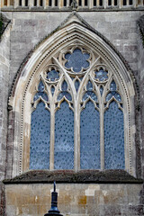An ornamental stained glass window in Wells Cathedral in Somerset