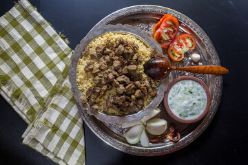 An Anatolian culture dish, bulgur pilaf and bean dish at the table