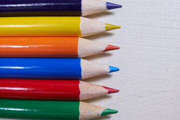 Colorful and sharpened artists pencils in rainbow colors