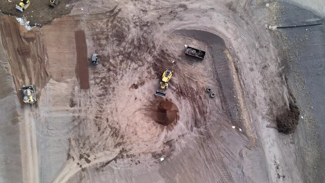 Heavy construction machine. Landfill compactor bulldozer. Waste management, trash dump, pollution, recycling plant, trash landfill. Garbage dump. Drone aerial shot 4k.
