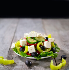 Greek salad with fresh vegetables, feta cheese and olives.